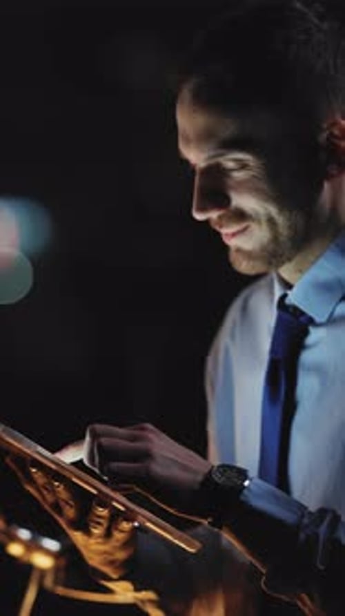 A Focused Professional Utilizing a Tablet Within a Modern and Stylish Workspace Environment