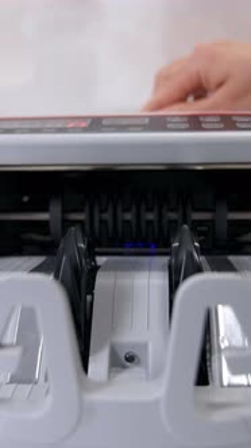 Currency counting machine counts dollar bills. Money counting equipment for paper money calculation