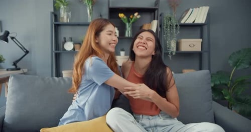 women teenager visit her close friends cuddling smiling at home. Overjoyed excited best buddies.