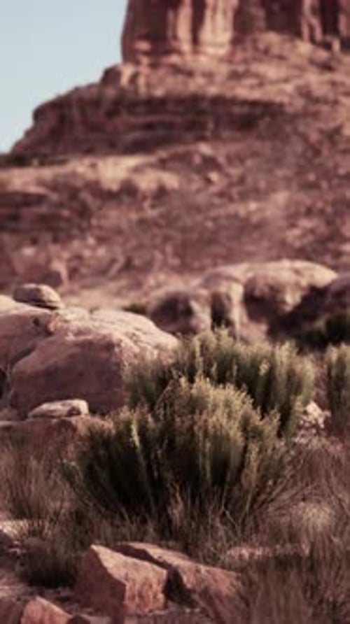 Man Riding Horse on Rocky Nevada Hillside
