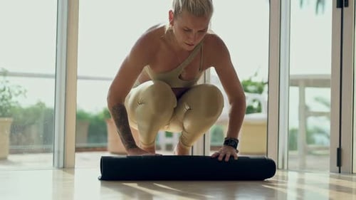 Woman, yoga mat and ready for home or studio fitness, holistic wellness and exercise gear