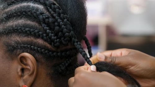 Hands Braiding Black Hair Close Up