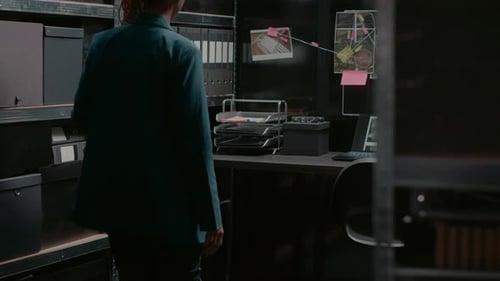 Woman in Cluttered Office Looks at Board
