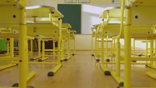 School Empty Classroom with White and Green Blackboard Educational Yellow Desks and Chairs