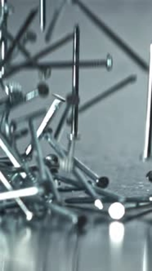Bright Nails Flung Across Textured Surface with Cool Tones Filmed on a Highspeed Camera at 1000 Fps