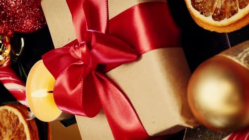 Holiday Present with Red Ribbon and Decorations