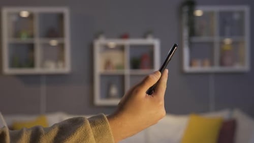 Hands Using Smartphone Indoors