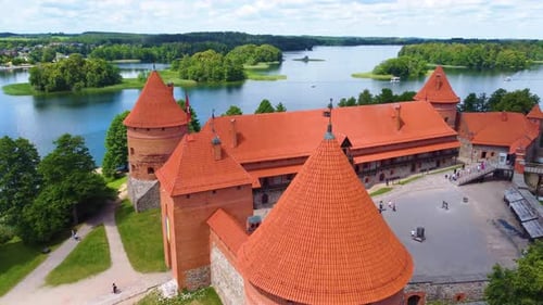 Red rooftop and historical castle of Trakai in Galve lake island, aerial view