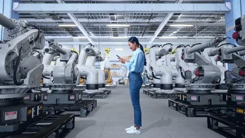 Asia Professional Female Works On Her Phone With Robotic Arms