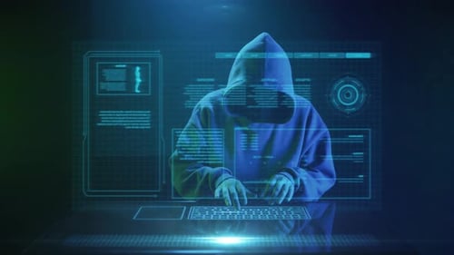 Hooded Person Typing in a Futuristic Setting