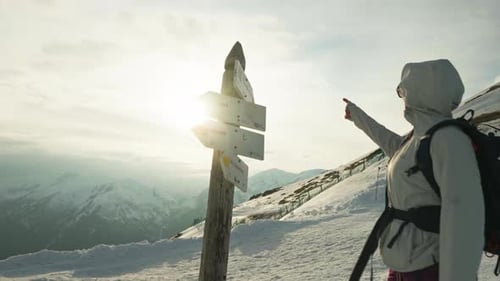 Woman Hiking in Snowy Mountains Landscape