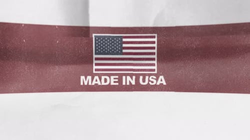 Made In USA Label with American Flag Reveal on Paper Texture