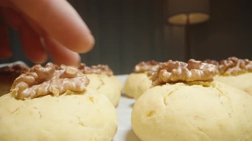 I Take Freshly Baked Cookies with Walnuts. Dolly slider extreme close-up.
