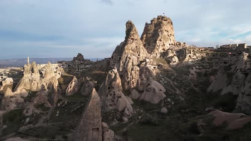 Aerial drone view of the Uchisar Castle in Cappadocia, Turkey during sunset