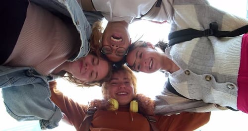 Smiling Friends Smiling and Looking at the Camera