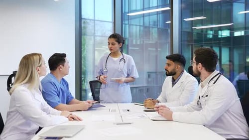 Medical Professionals Collaborating in Modern Office Meeting