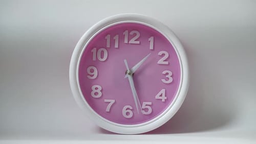 Pink Clock of the White Background