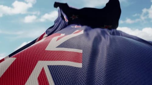 Realistic New Zealand Flag Waving against Blue Sky