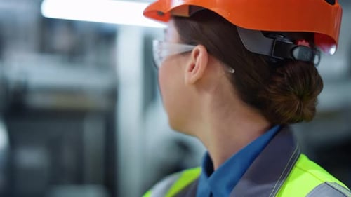 Industrial Engineer Working in Modern Production Factory Closeup. Professional Worker Analyzing Logi