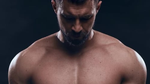 Fit and Sporty Bodybuilder Over Black Background Bodybuilder Training Using Barbell The Concept of