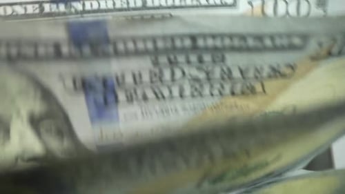 Macro Shot Counter Counting Dollar Bills Money Counting Machine with 100 Dollar Banknotes Bank