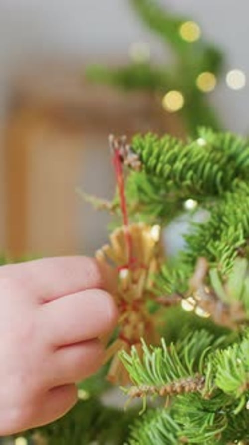 Festive Holiday Moments Young Hand Arranges Handmade Ornament Delicately Celebrating Winter