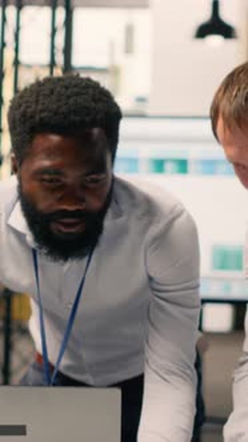 Vertical Video Corporate Professionals Analyzing Charts KPI Dashboards on Laptop