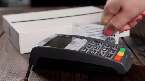 Closeup of Paying an Invoice or a Purchase with a Credit Card