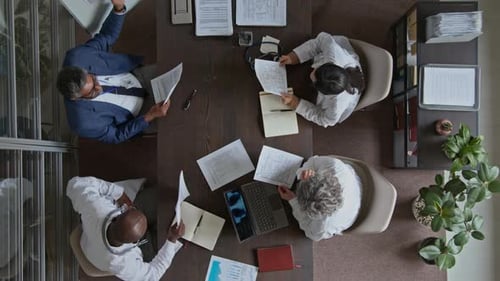 Top View of Chief Doctors and Head of Clinic Having Medical Meeting