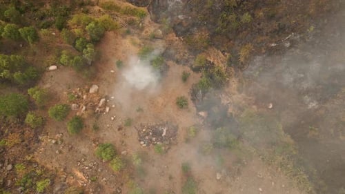 Aerial View of Rural Landscape with Fire and Smoke