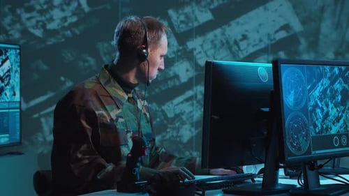Military Soldier Operating Advanced Technology in a Command Center