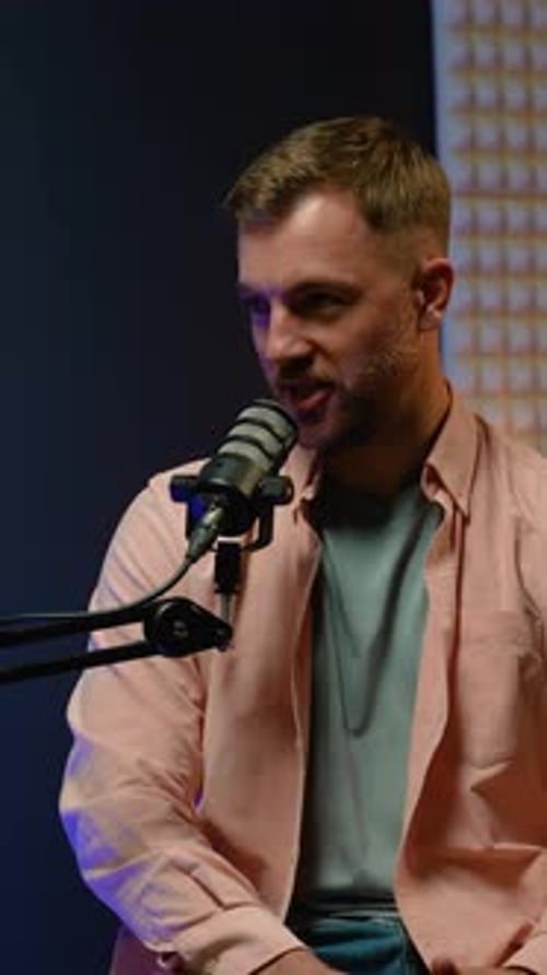 Man Recording Podcast Talking Into Microphone Vertical Video