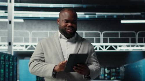 Server Farm Employee Upgrading Gear for Increased Processing