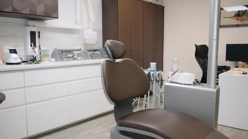 Dental Clinic Interior With Dental Chair And Other Medical Equipment, wide shot