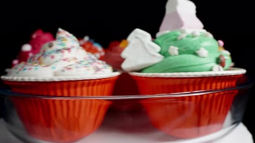 Rotating Colorful Cupcakes with Sprinkles and Candies