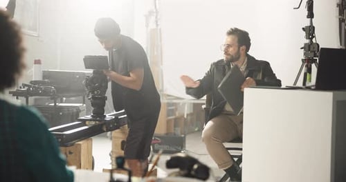 Film Crew Collaborating in Studio Space