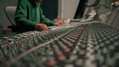 Sound engineer used digital audio mixer Sliders Engineer presses keys Control panel Recording studio