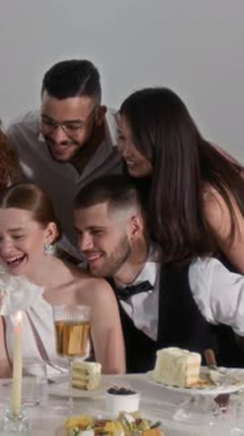 Friends Celebrate Birthday Party with Cake and Candle