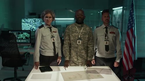 Portrait of Diverse USA Army Officers by Light Table in Command Center