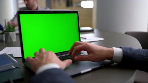 Manager Typing Laptop Keyboard Green Screen Analyze Corporate Data In Office Conference Table. Cl...