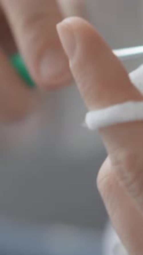 Hands Crocheting White Yarn Close Up