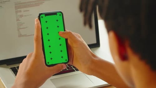 African American Man Using Smartphone with Chroma Key Closeup