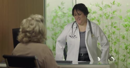 Doctor Consulting with Patient in Bright Modern Office