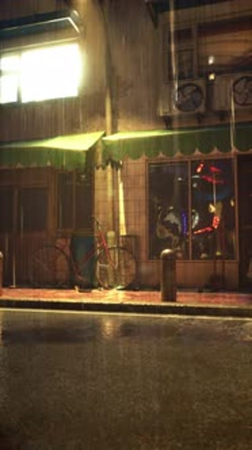 Rainy Night in City With Bicycle Parked