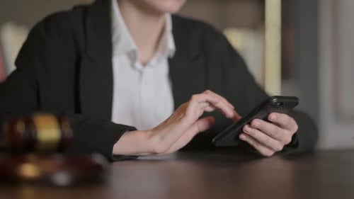 Close up of Female Lawyer using Smartphone