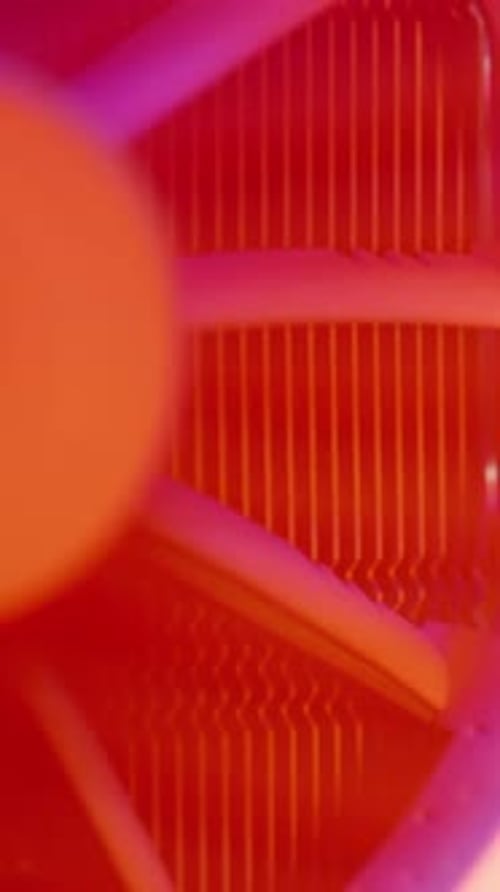 Vertical video. Close-up of a rotating cooler with a radiator for the processor in a PC, multicolore