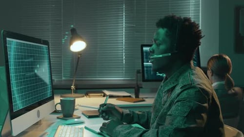 Man in Office Works at Computer Late at Night