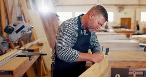 Man, carpenter and wood with drawing at workshop for furniture and design