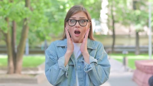 Woman Reacting in Shock and Celebration Outdoors