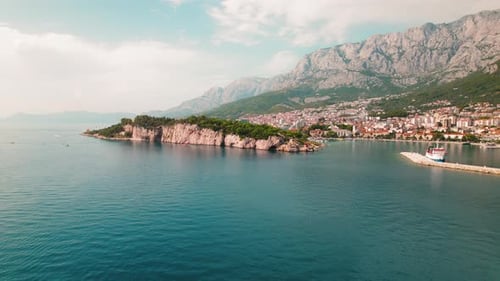 Makarska Riviera with seascape. Aerial view of a lush peninsula cradling the serene Croatian watersi